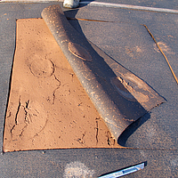 Vue de la boue séchée dans le tuyau de drainage SoilTain